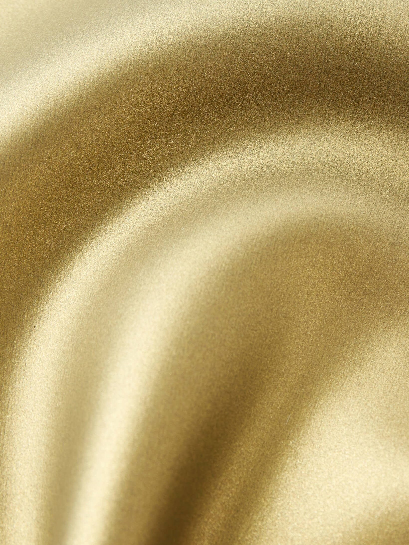 Closeup shot showing the colour of the gold super smooth glide skin coating on the mens training two piece freediving wetsuits