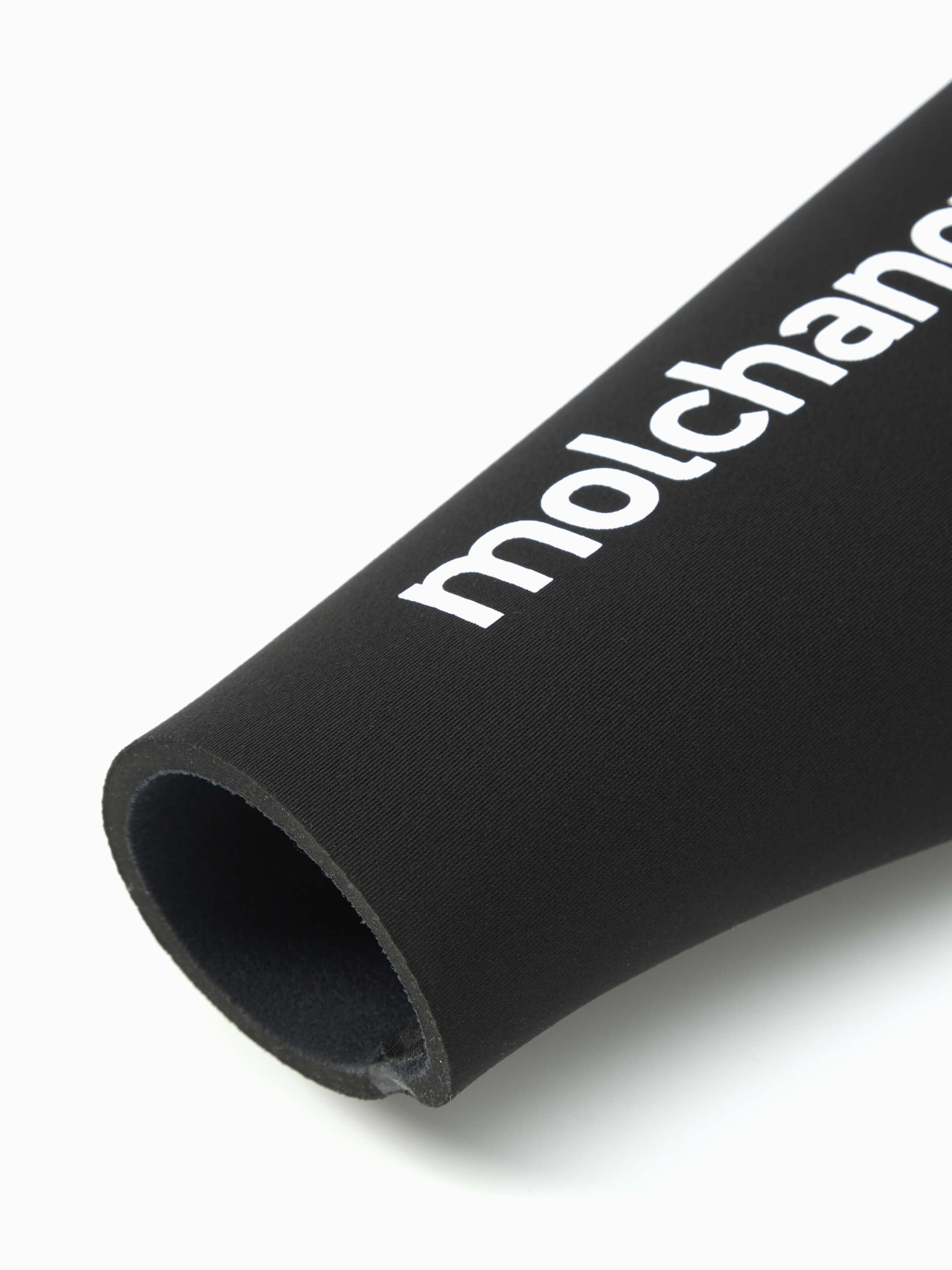 Close up of the cut of the wetsuit wrist seal and Molchanovs wording on the sleeve. 